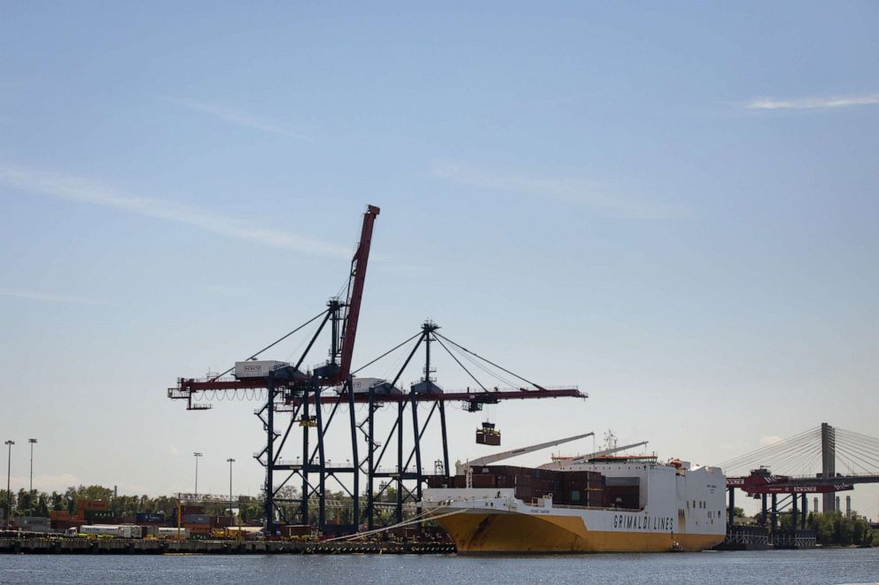 PHOTO: A shipping container is loaded onto a cargo ship at the New York Container Terminal in Staten Island, May 7, 2019.