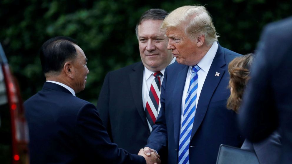 PHOTO: North Korean envoy Kim Yong Chol shakes hands with President Donald Trump as Secretary of State Mike Pompeo looks on after a meeting at the White House June 1, 2018.