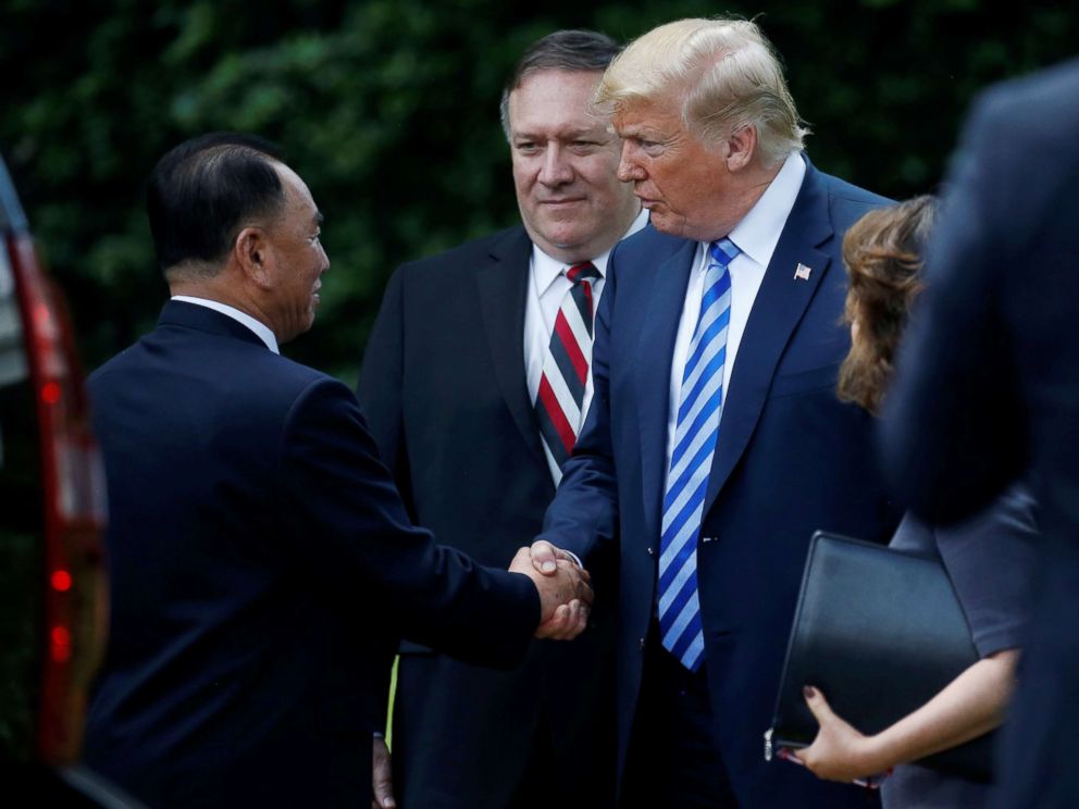 PHOTO: North Korean envoy Kim Yong Chol shakes hands with President Donald Trump as Secretary of State Mike Pompeo looks on after a meeting at the White House June 1, 2018.