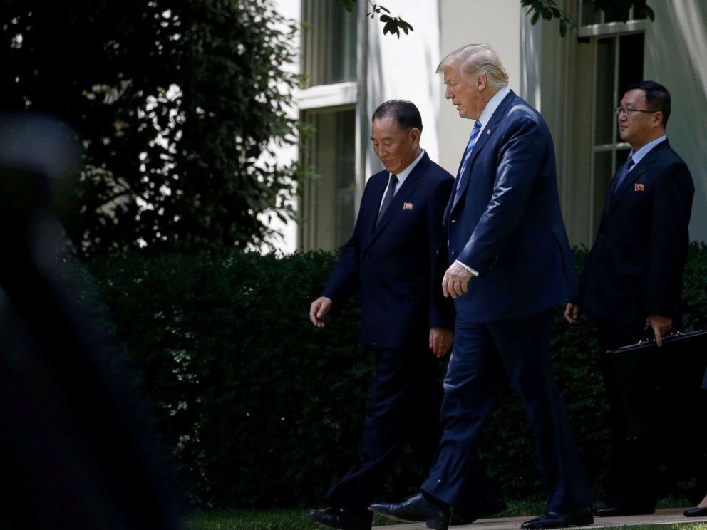 PHOTO: North Korean envoy Kim Yong Chol talks with President Donald Trump as they walk out of the Oval Office after a meeting at the White House, June 1, 2018 in Washington, D.C.