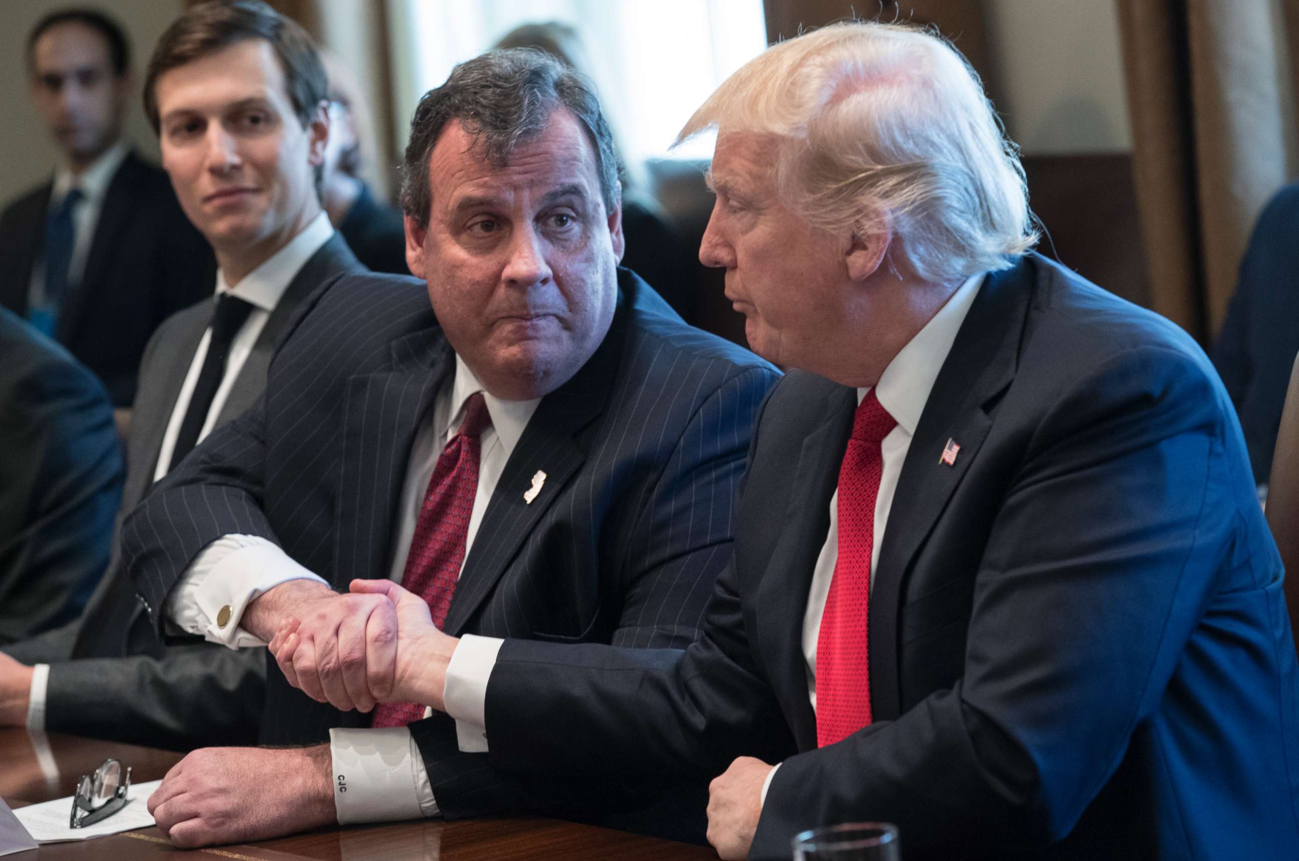 PHOTO: President Donald Trump, left, shakes hands with New Jersey Gov. Chris Christie at a panel discussion on an opioid and drug abuse in the Roosevelt Room of the White House March 29, 2017.