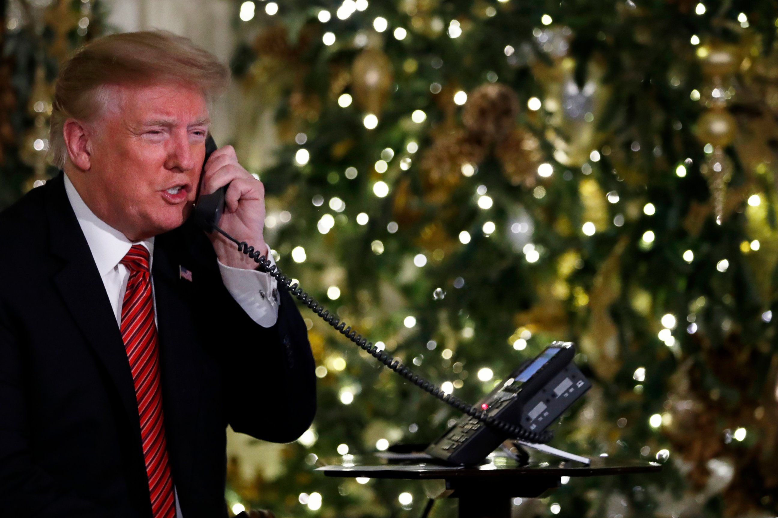 PHOTO: President Donald Trump speaks on the phone sharing updates to track Santa's movements from the North American Aerospace Defense Command (NORAD) Santa Tracker on Christmas Eve, Monday, Dec. 24, 2018. 