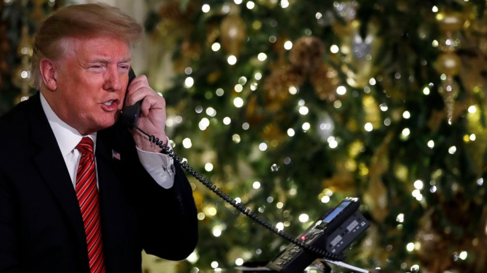 PHOTO: President Donald Trump speaks on the phone sharing updates to track Santa's movements from the North American Aerospace Defense Command (NORAD) Santa Tracker on Christmas Eve, Monday, Dec. 24, 2018.