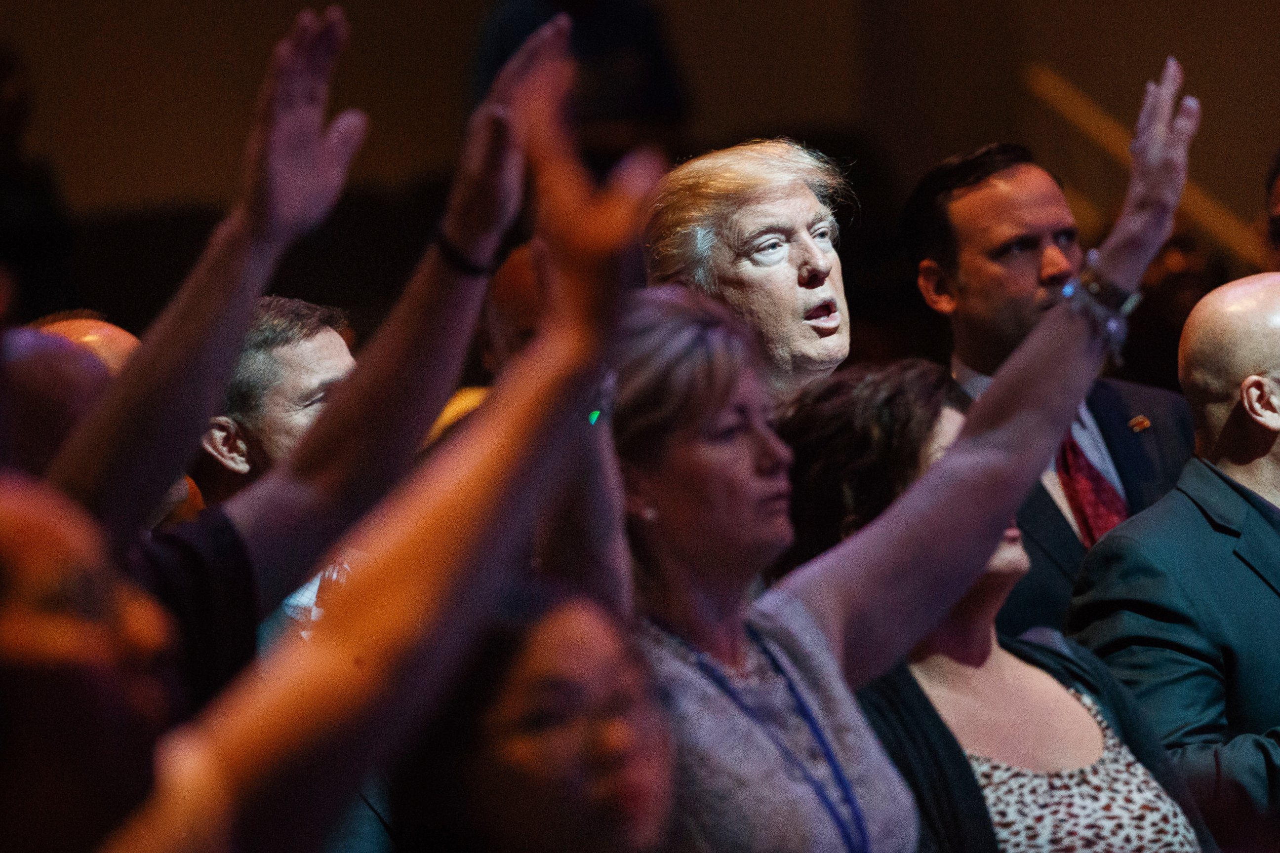 In this Oct. 30, 2016, file photo, Republican presidential candidate Donald Trump stands during a service at the International Church of Las Vegas in Las Vegas. 