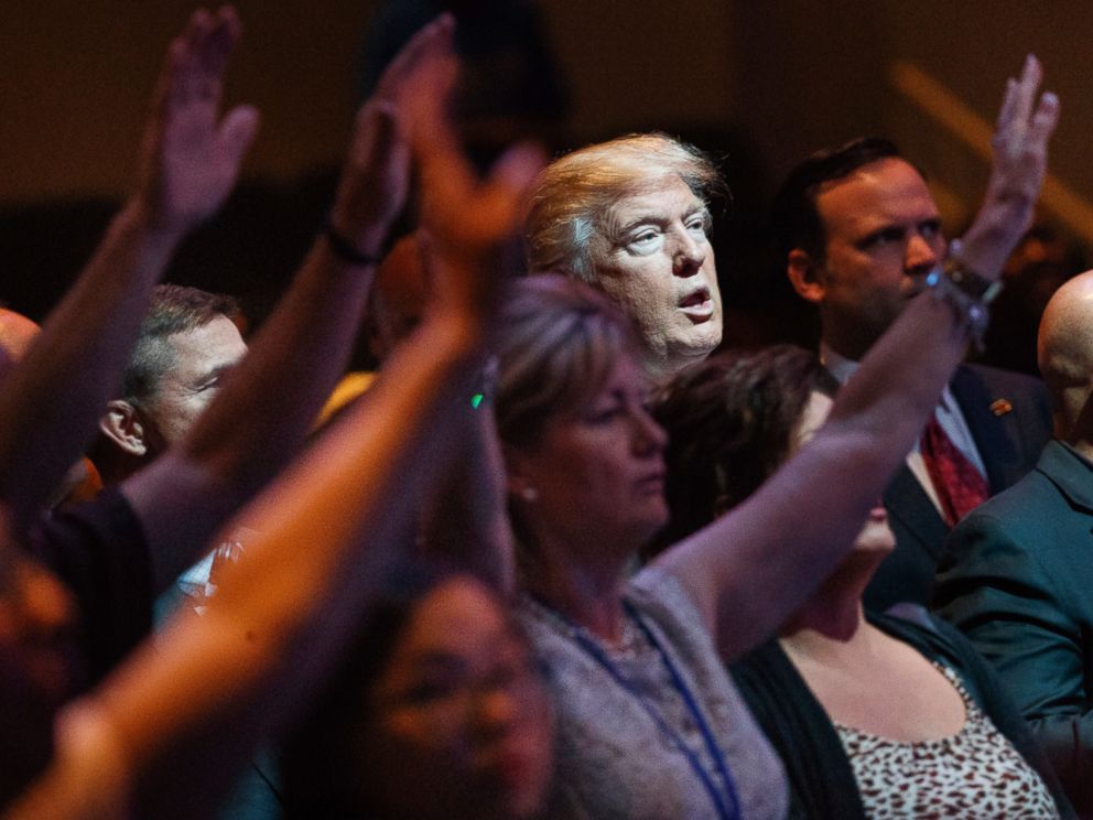 In this Oct. 30, 2016, file photo, Republican presidential candidate Donald Trump stands during a service at the International Church of Las Vegas in Las Vegas.