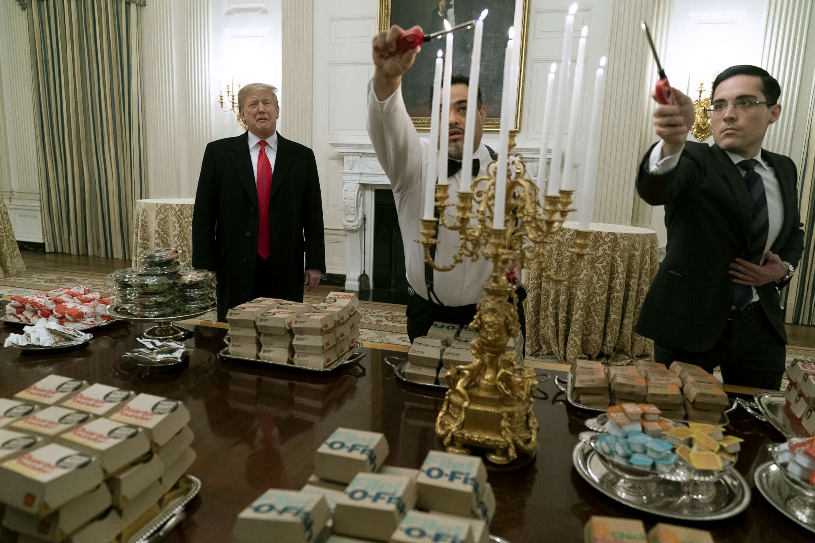 PHOTO: President Donald Trump presents fast food to be served to the Clemson Tigers in celebration of their national championship at the White House, Jan. 14, 2019.
