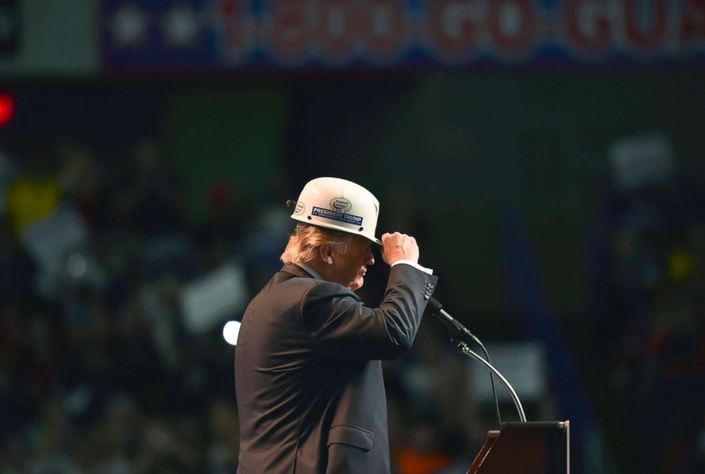 PHOTO: Republican presidential candidate Donald Trump wears a coal miner's hat while addressing his supporters during a rally at the Charleston Civic Center on May 5, 2016 in Charleston, WVa.