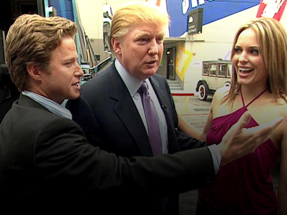 PHOTO: In this 2005 frame from video, Donald Trump prepares for an appearance on Days of Our Lives with actress Arianne Zucker, right. He is accompanied to the set by Access Hollywood host Billy Bush, left.