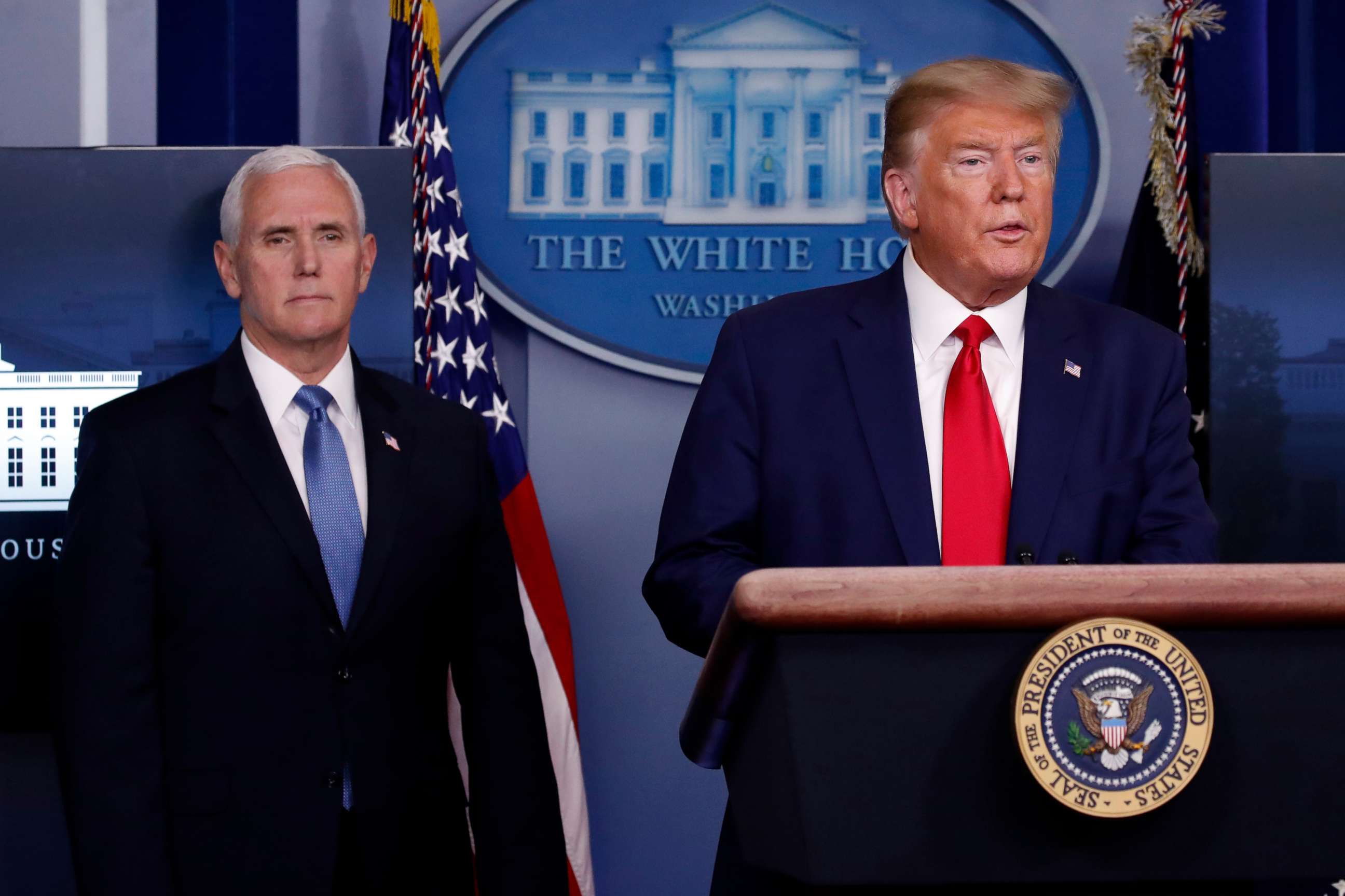 PHOTO: President Donald Trump speaks about the coronavirus in the James Brady Press Briefing Room of the White House, March 31, 2020, in Washington, as Vice President Mike Pence listens.