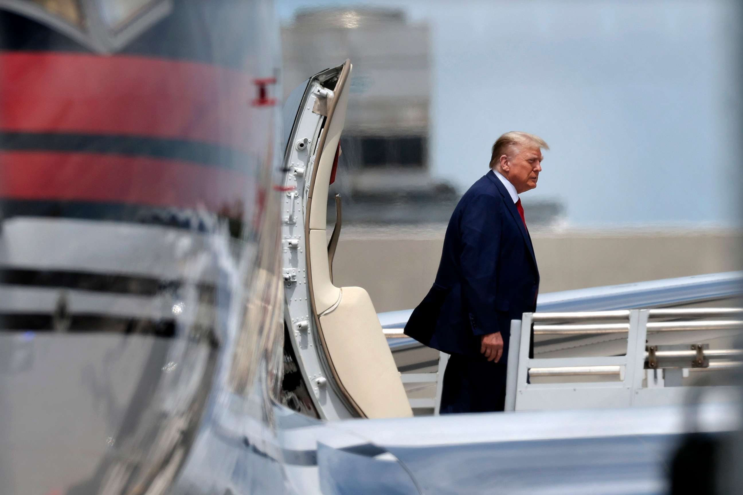 PHOTO: Republican presidential candidate former President Donald Trump arrives at the Miami International Airport on June 12, 2023, in Miami.