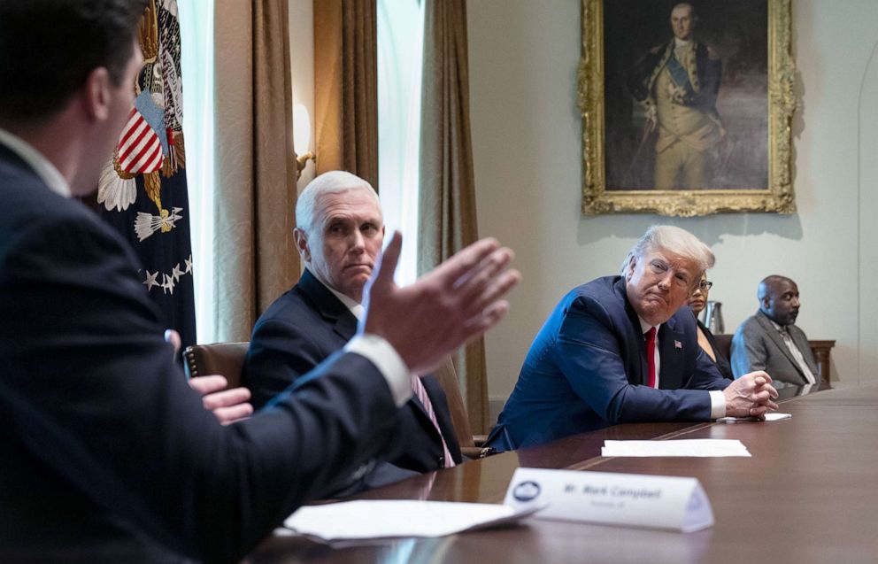 PHOTO: Former Michigan football player Mark Campbell makes remarks about his bout with coronavirus as President Donald Trump and Vice President Mike Pence listening during a meeting with recovered COVID-19 patients at the White House, April 14, 2020.