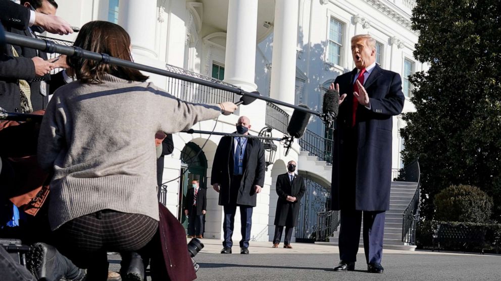 PHOTO: President Donald Trump talks to the media before boarding Marine One on the South Lawn of the White House, Jan. 12, 2021, in Washington.