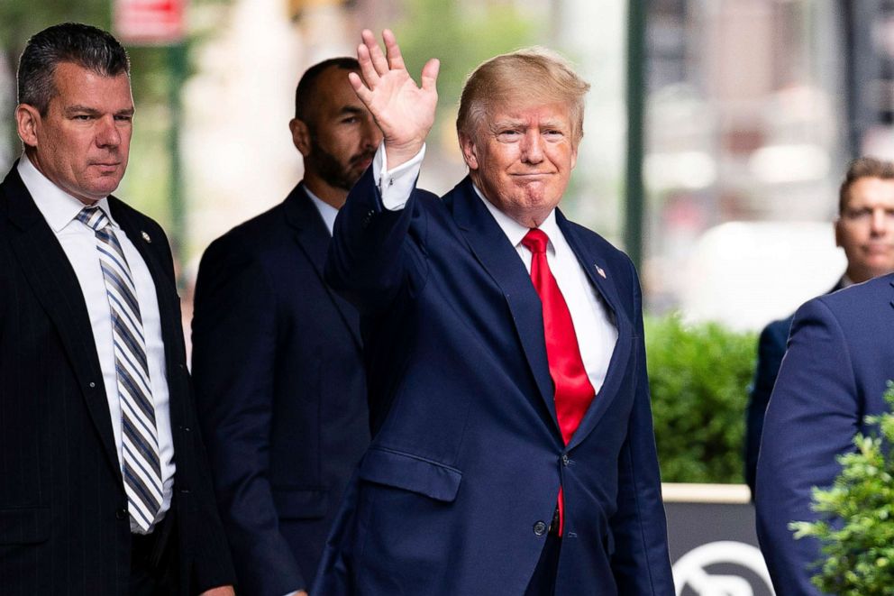 PHOTO: Former President Donald Trump waves as he departs Trump Tower, Aug. 10, 2022, in New York, on his way to the New York attorney general's office for a deposition in a civil investigation.