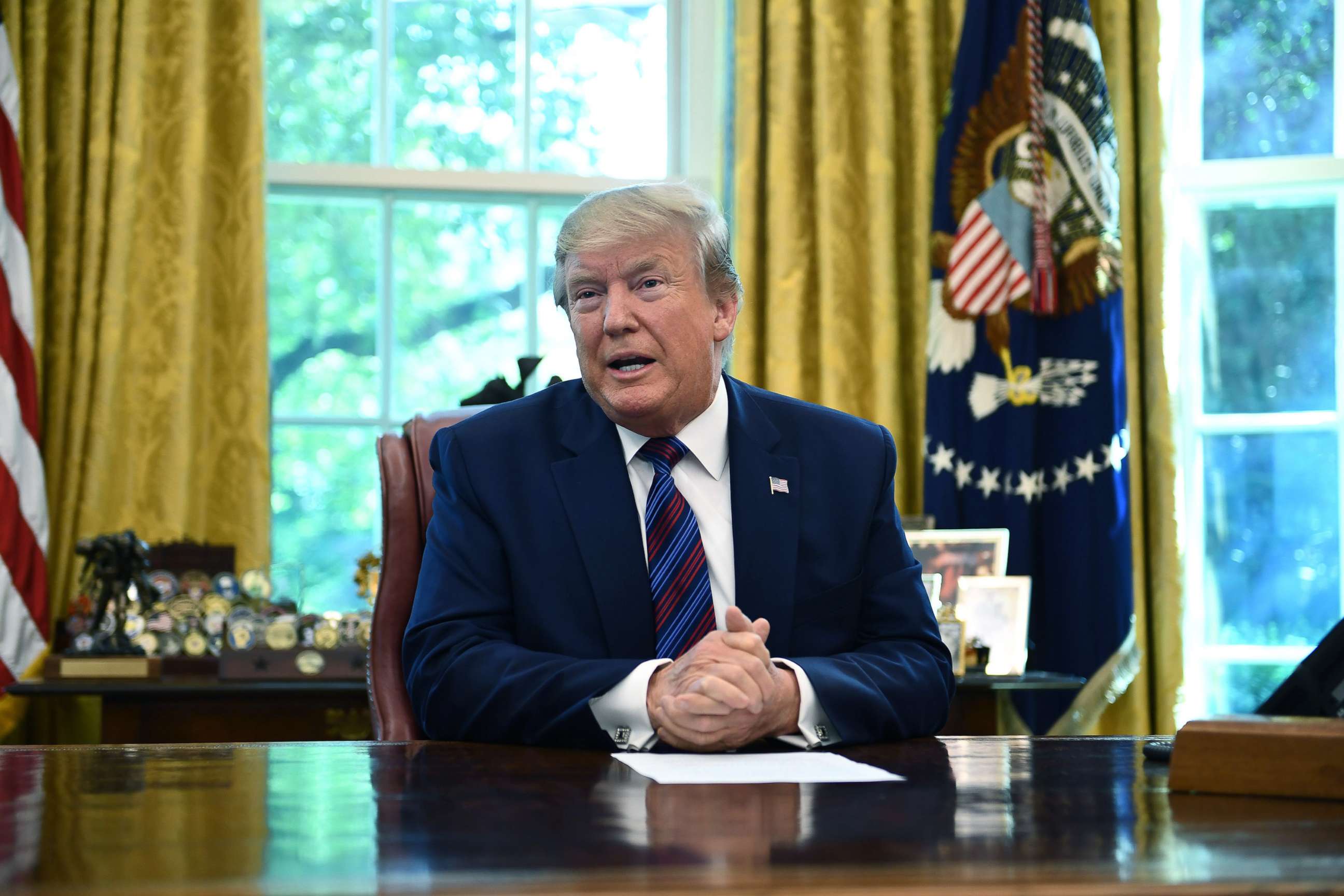 PHOTO: President Donald Trump speaks to the media in the Oval Office of the White House, July 26, 2019.