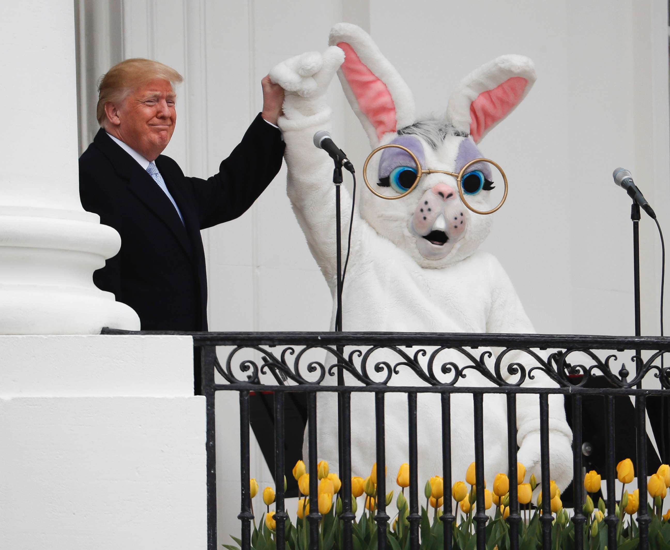 PHOTO: President Donald Trump and the Easter Bunny, after speaking to the crowd on the Truman Balcony during the annual White House Easter Egg Roll on the South Lawn of the White House in Washington, April 2, 2018. 