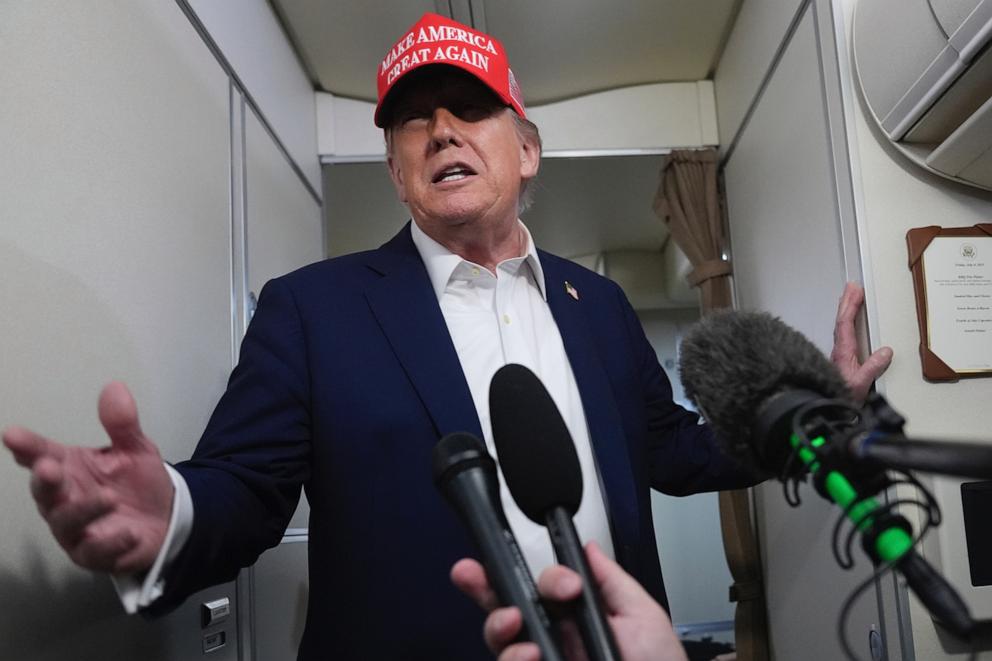 PHOTO: President Donald Trump speaks to reporters on board Air Force One, en route from Joint Base Andrews, Md., to Morristown Municipal Airport in Morristown, N.J., Friday, July 4, 2025.