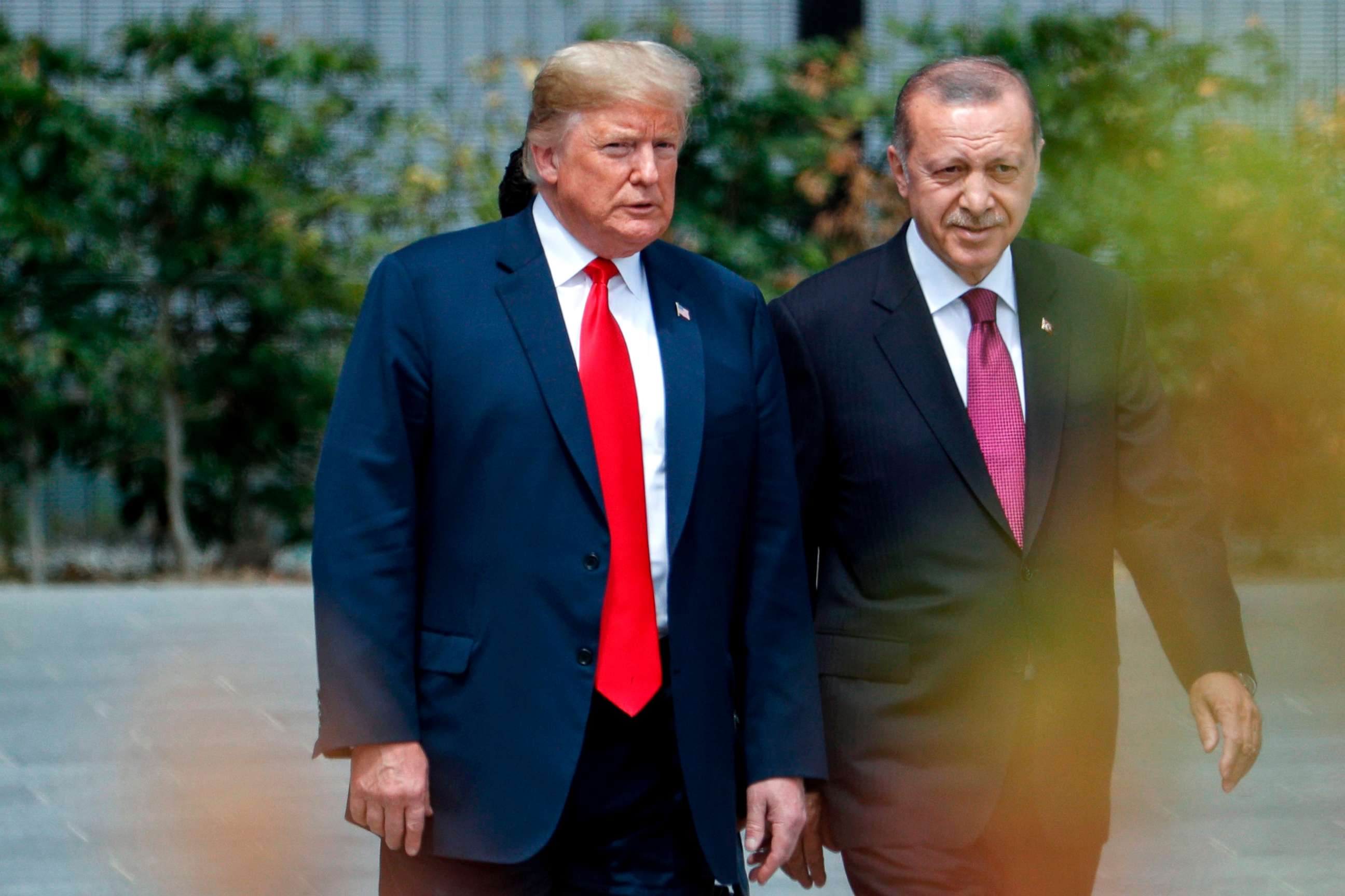 PHOTO: President Donald Trump speaks to Turkey's President Recep Tayyip Erdogan during the opening ceremony of the NATO summit at the NATO headquarters in Brussels.