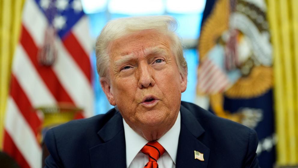 PHOTO: President Donald Trump speaks with reporters as he signs an executive order in the Oval Office at the White House, Feb. 10, 2025, in Washington.