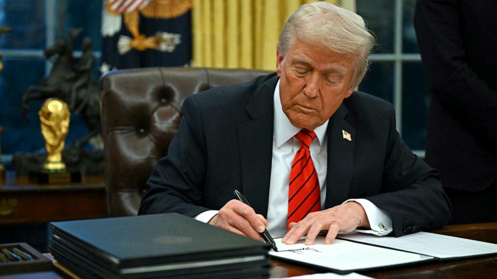 PHOTO: President Donald Trump signs an executive order in the Oval Office of the White House in Washington, D.C., on Feb. 10, 2025. 