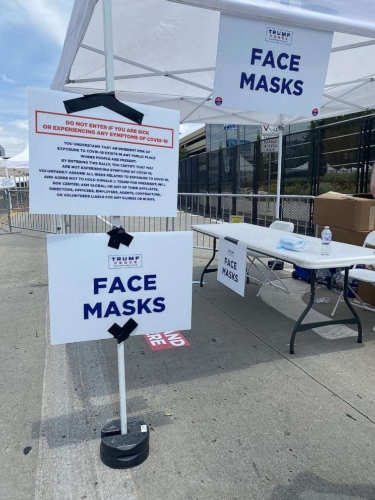 PHOTO: Face masks were available outside the BOK Center in Tulsa, Okla., as attendees entered a rally for Donald Trump's reelection campaign on June 20, 2020.