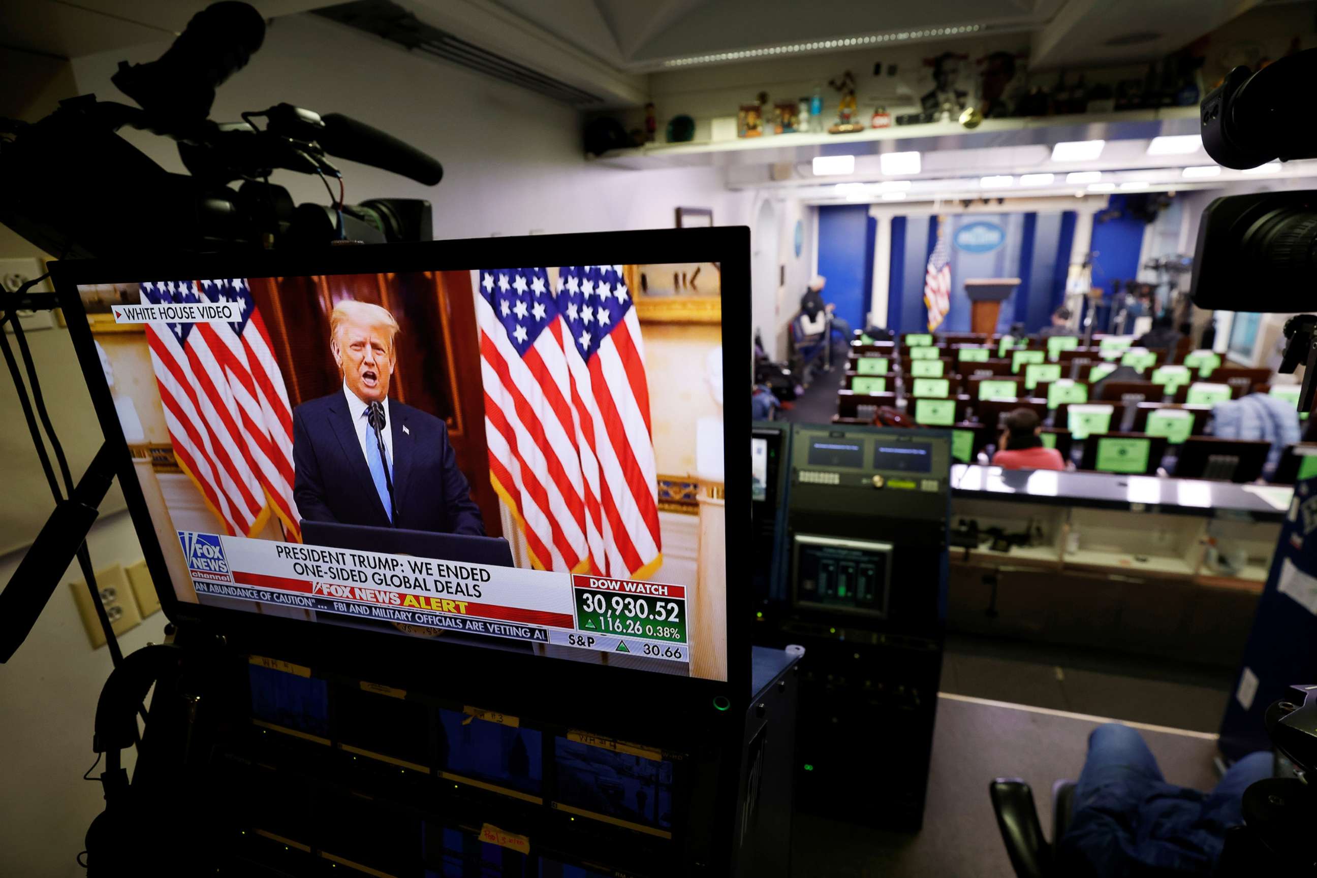 PHOTO: President Donald Trump makes remarks on a television monitor from the White House Briefing Room during his last day in office, Jan. 19, 2021.