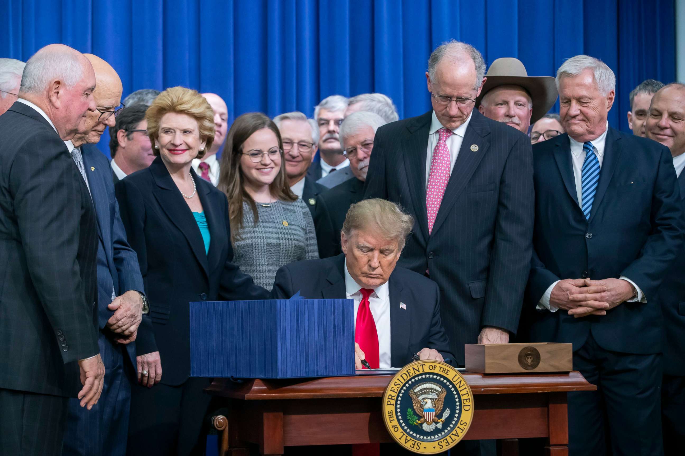 PHOTO: President Donald Trump signs the Agriculture Improvement Act of 2018 farm bill at the White House in Washington, Dec. 20, 2018.