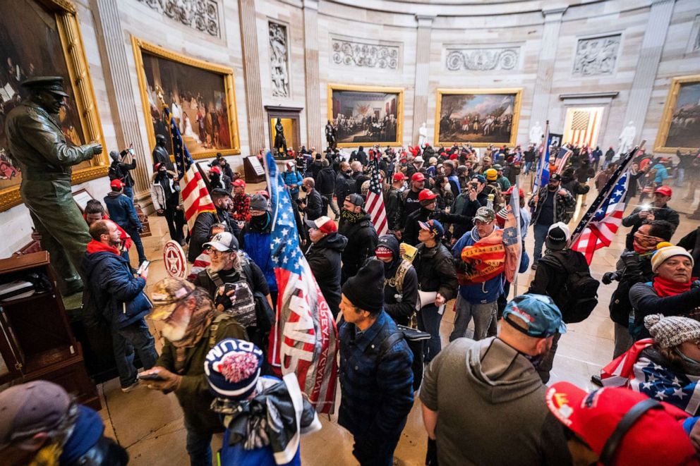 PHOTO: In this Jan. 6, 2020 file photo supporters of President Donald J. Trump run through the Rotunda of the Capitol after breaching Capitol security during their protest in Washington, D.C. 