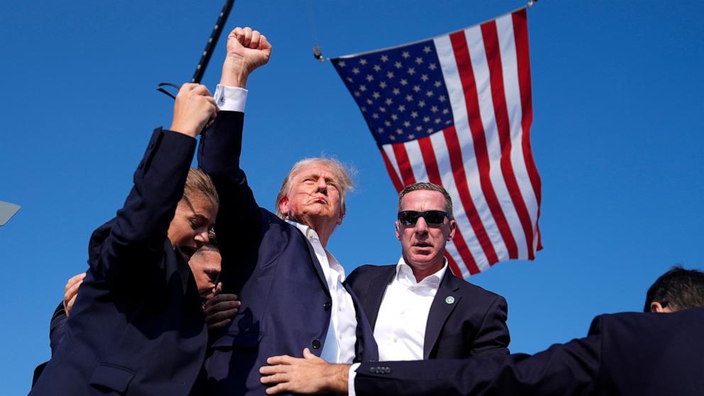 PHOTO: Republican presidential candidate former President Donald Trump is surrounded by U.S. Secret Service agents at a campaign rally, July 13, 2024, in Butler, Pa.