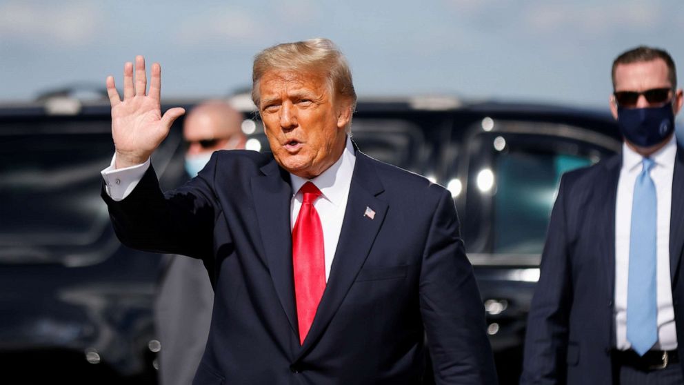 PHOTO: President Donald Trump waves as he arrives at Palm Beach International Airport in West Palm Beach, Fla., Jan. 20, 2021.