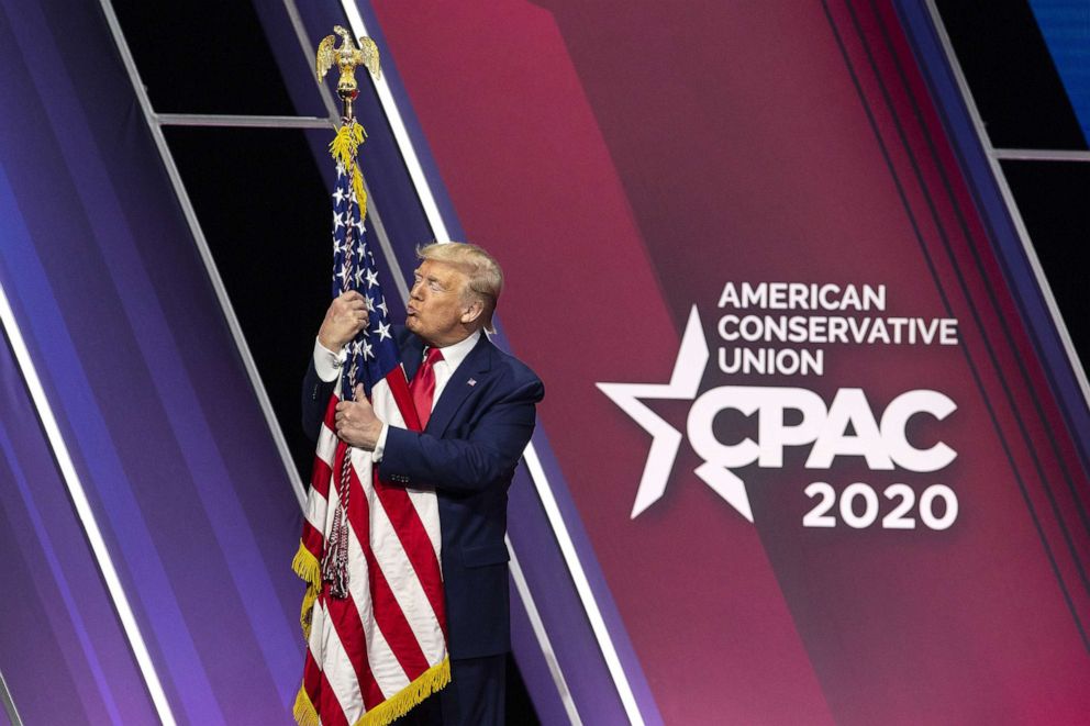 PHOTO: President Donald Trump hugs and kisses the American flag during the Conservative Political Action Conference (CPAC) in National Harbor, Md., Feb. 29, 2020. 