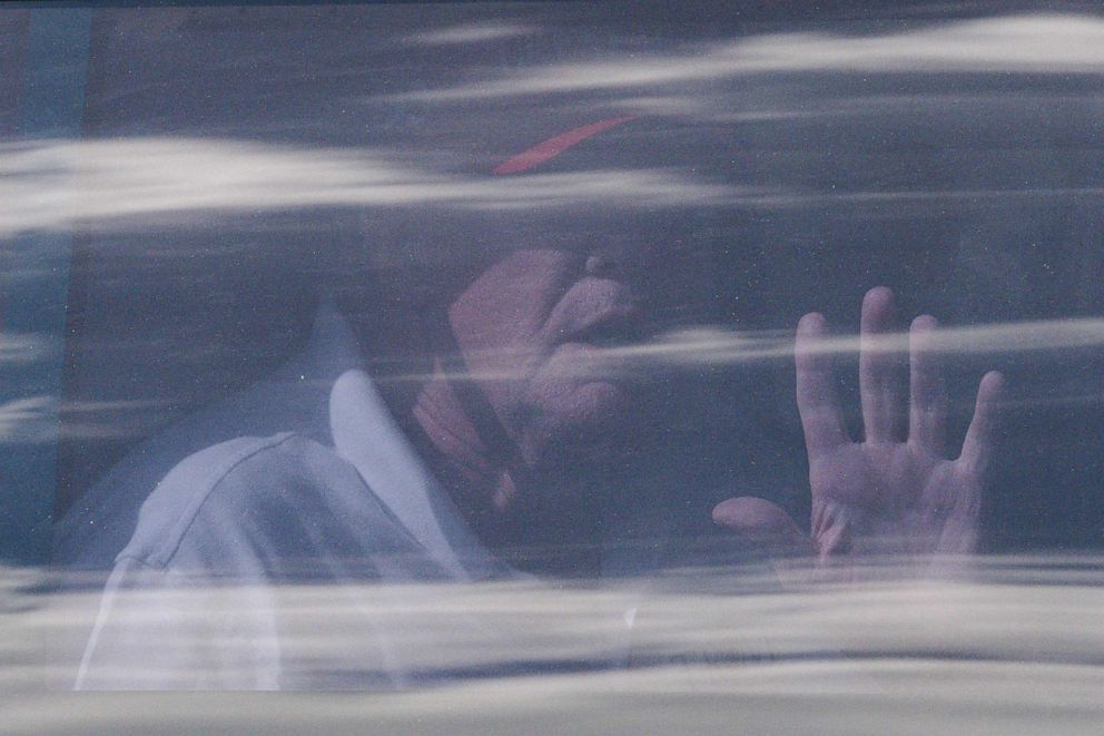 PHOTO: Former President Donald Trump sits in the rear of his limousine as he departs Trump International Golf Club in West Palm Beach, Florida, on April 1, 2023.