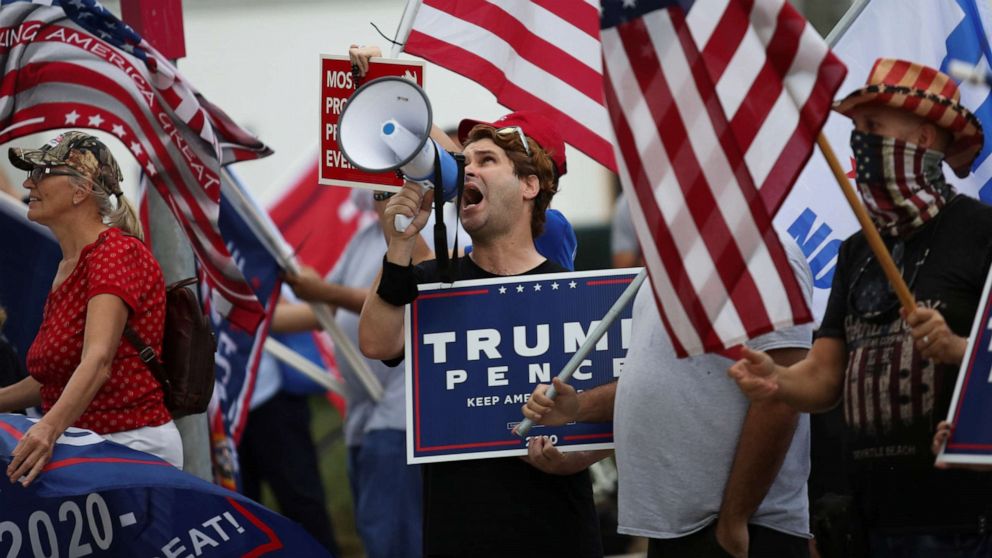 PHOTO: Supporters of President Donald Trump gather outside Perez Art Museum before his arrival for a town hall in Miami, Oct. 15, 2020.