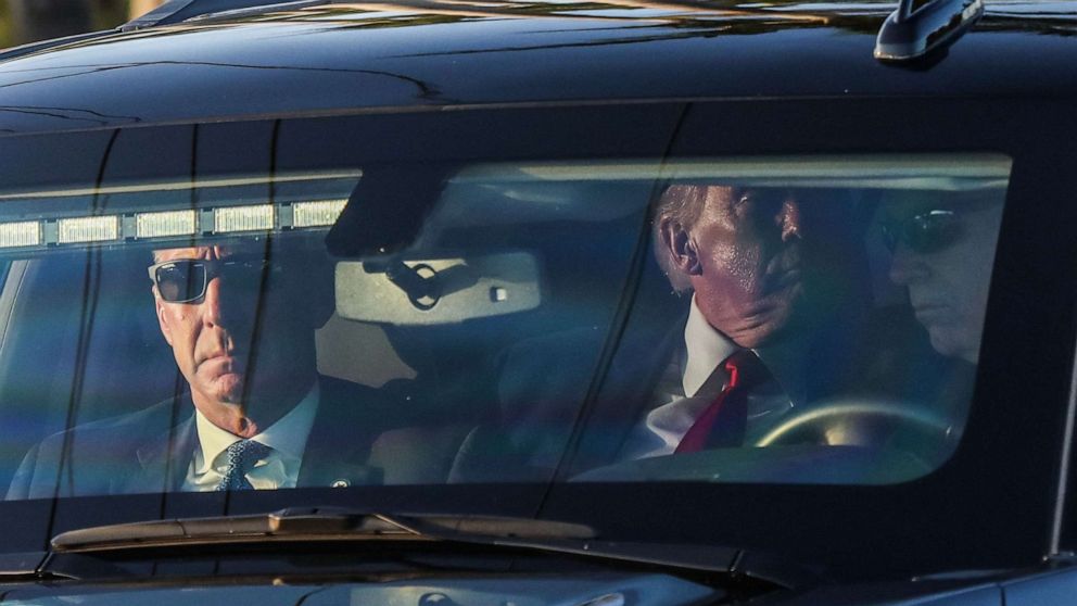 PHOTO: Former President Donald Trump (C) departs in a motorcade from Palm Beach International Airport in West Palm Beach, Fla., on April 4, 2023.