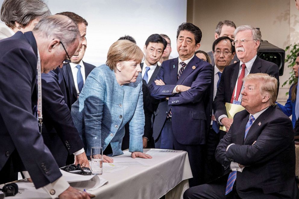 PHOTO: German Chancellor Angela Merkel speaks with President Donald Trump on the sidelines of the official agenda of the G7 summit on June 9, 2018, in Charlevoix, Canada.