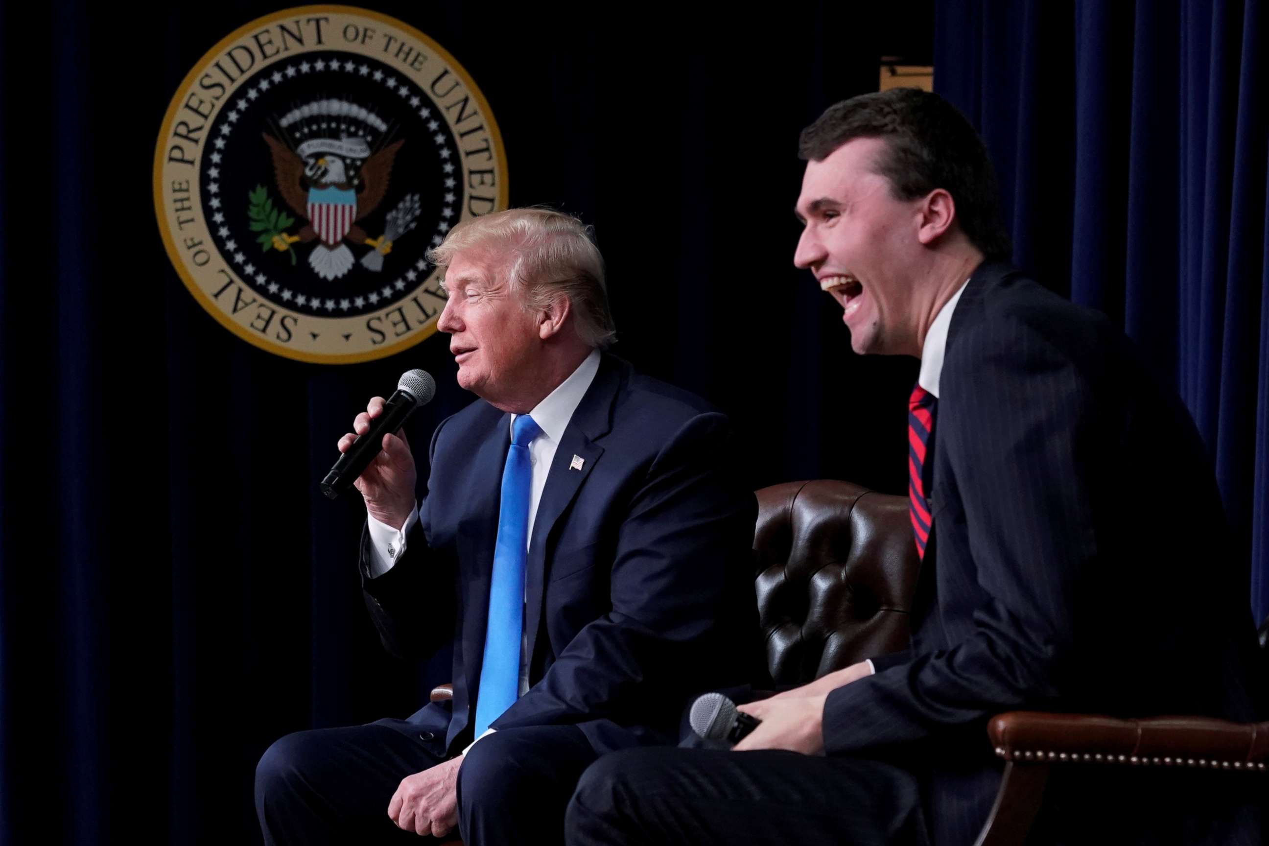 PHOTO: Charlie Kirk, founder of Turning Point USA, laughs after President Donald Trump said that if he could go back in time and give himself advice at age 25 it would be to not run for president, during a youth forum at the White House, March 22, 2018.