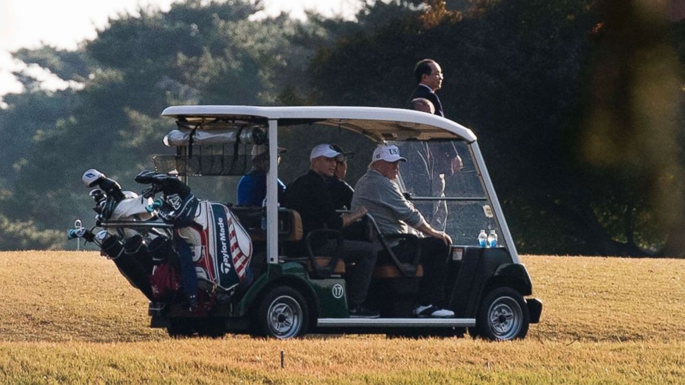 PHOTO: President Donald Trump (front R) and Japanese Prime Minister Shinzo Abe (front L) return in a golf cart after playing a round of golf at the Kasumigaseki Country Club Golf Course in Kawagoe, Saitama prefecture, outside Tokyo, Nov. 5, 2017.