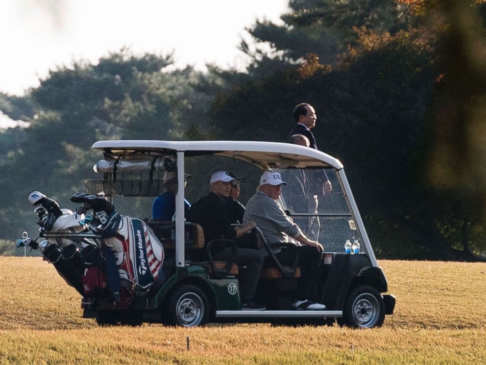 PHOTO: President Donald Trump (front R) and Japanese Prime Minister Shinzo Abe (front L) return in a golf cart after playing a round of golf at the Kasumigaseki Country Club Golf Course in Kawagoe, Saitama prefecture, outside Tokyo, Nov. 5, 2017.