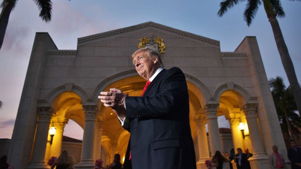 PHOTO: President Donald Trump watches the Palm Beach Central High School marching band perform as it greets him upon his arrival to watch the Super Bowl at Trump International Golf Club Palm Beach in West Palm Beach, Fla., Feb. 5, 2017.