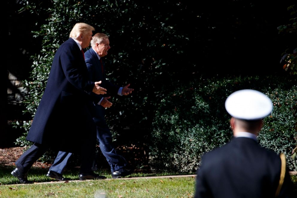 PHOTO: President Donald Trump walks to the Oval Office with Sen. Lindsey Graham, R-S.C., Thursday, Nov. 8, 2018, in Washington.
