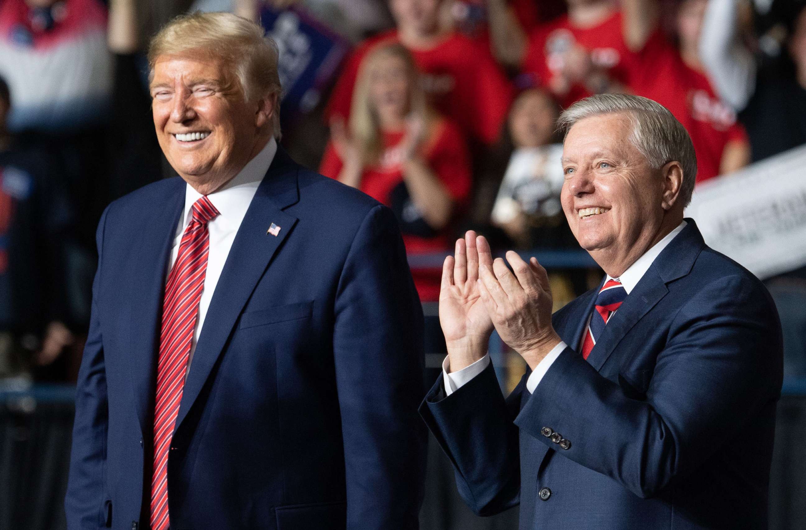 PHOTO: President Donald Trump smiles as he stands alongside Senator Lindsey Graham during a Keep America Great campaign rally in North Charleston, South Carolina, Feb. 28, 2020. 