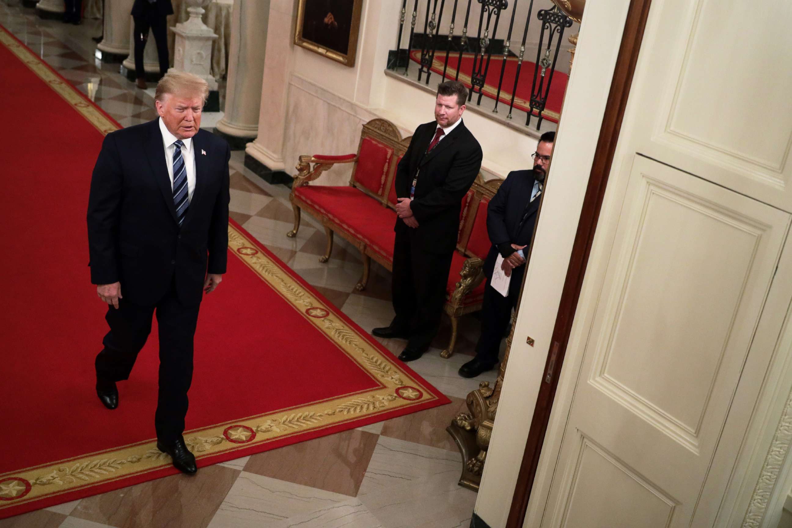 PHOTO: President Donald Trump enters the East Room for an event at the White House in Washington, D.C., Nov. 7, 2019.