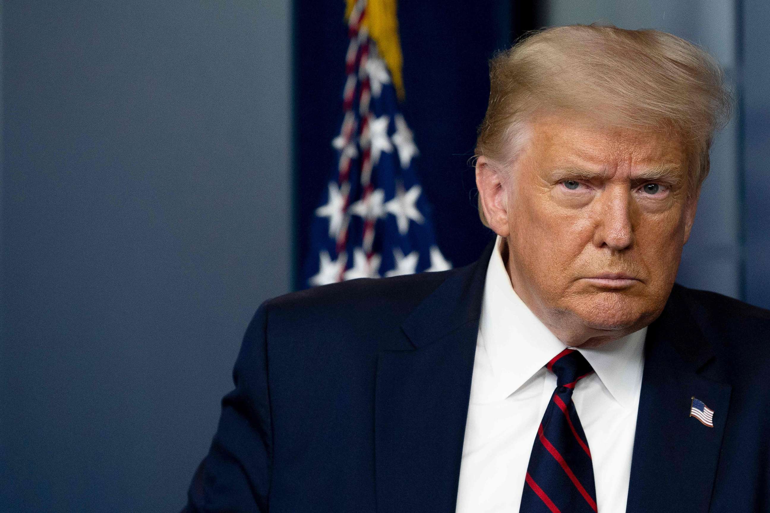 PHOTO: President Donald Trump arrives to speak at the press briefing at the White House, July 30, 2020. 