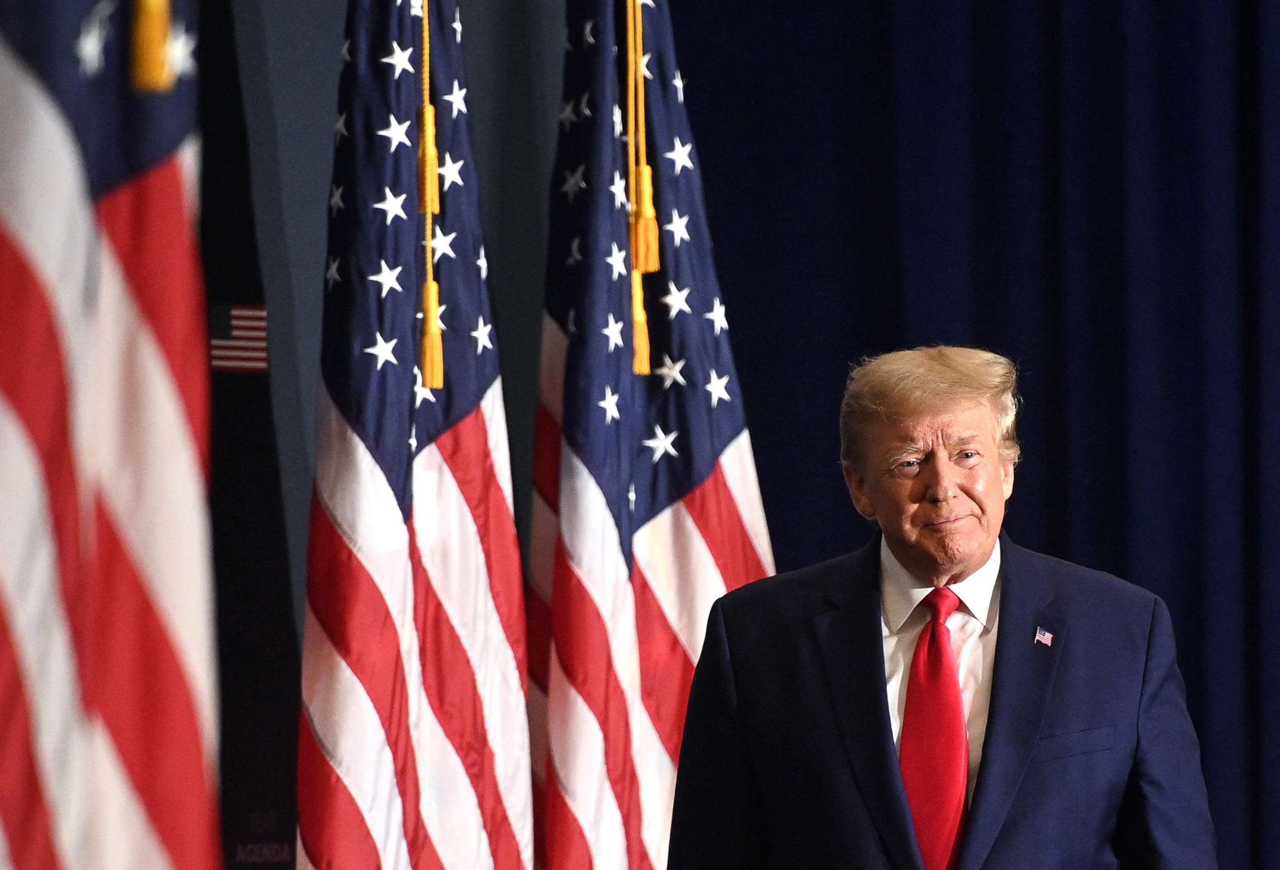 PHOTO: Former President Donald Trump arrives to speak at the America First Policy Institute Agenda Summit in Washington, D.C., on July 26, 2022.