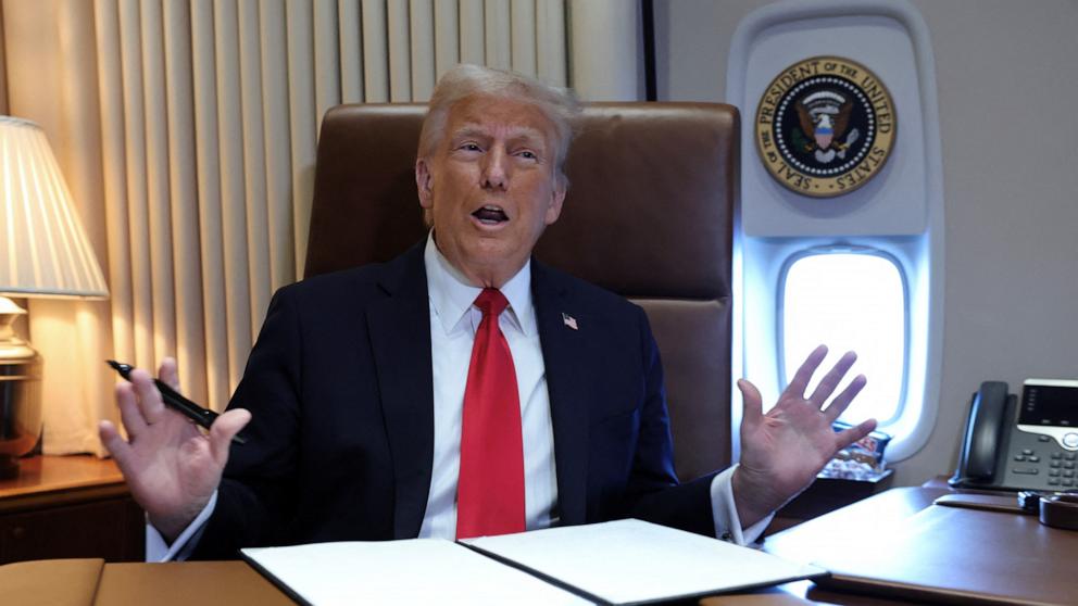 PHOTO: President Donald Trump speaks to reporters before signing a proclamation renaming the Gulf of Mexico to the Gulf of America, while flying over the gulf aboard Air Force One en route to New Orleans to attend the Super Bowl, Feb. 9,  2025. 