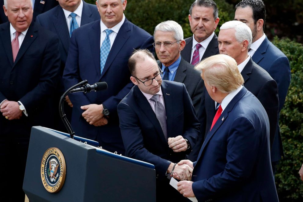 PHOTO: President Donald Trump shakes hands Richard Ashworth, president of Walgreens, during a news conference about the coronavirus in the Rose Garden at the White House, March 13, 2020, in Washington.