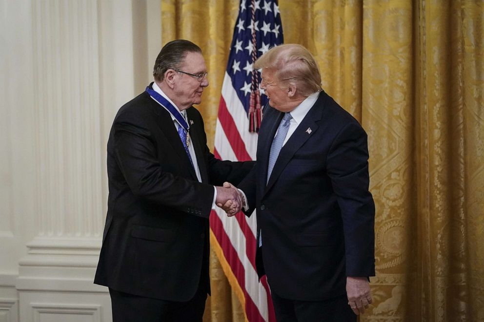 PHOTO: President Donald Trump shakes hands with retired four-star Army general Jack Keane after presenting him with the Presidential Medal of Freedom to  during a ceremony in the East Room of the White House, March 10, 2020.