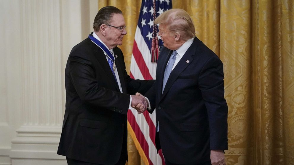 PHOTO: President Donald Trump shakes hands with retired four-star Army general Jack Keane after presenting him with the Presidential Medal of Freedom to  during a ceremony in the East Room of the White House, March 10, 2020.