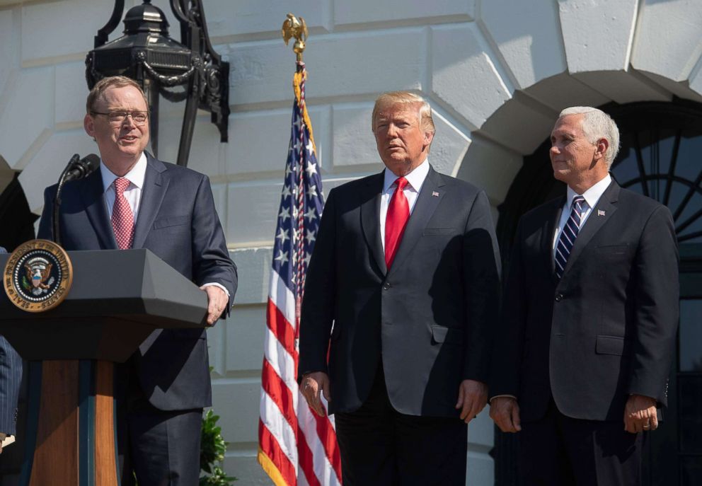 PHOTO: Kevin Hassett, Chair of the Council of Economic Advisers, speaks about the economy as President Donald Trump and Vice President Mike Pence listen, July 27, 2018, on the South Lawn of the White House.