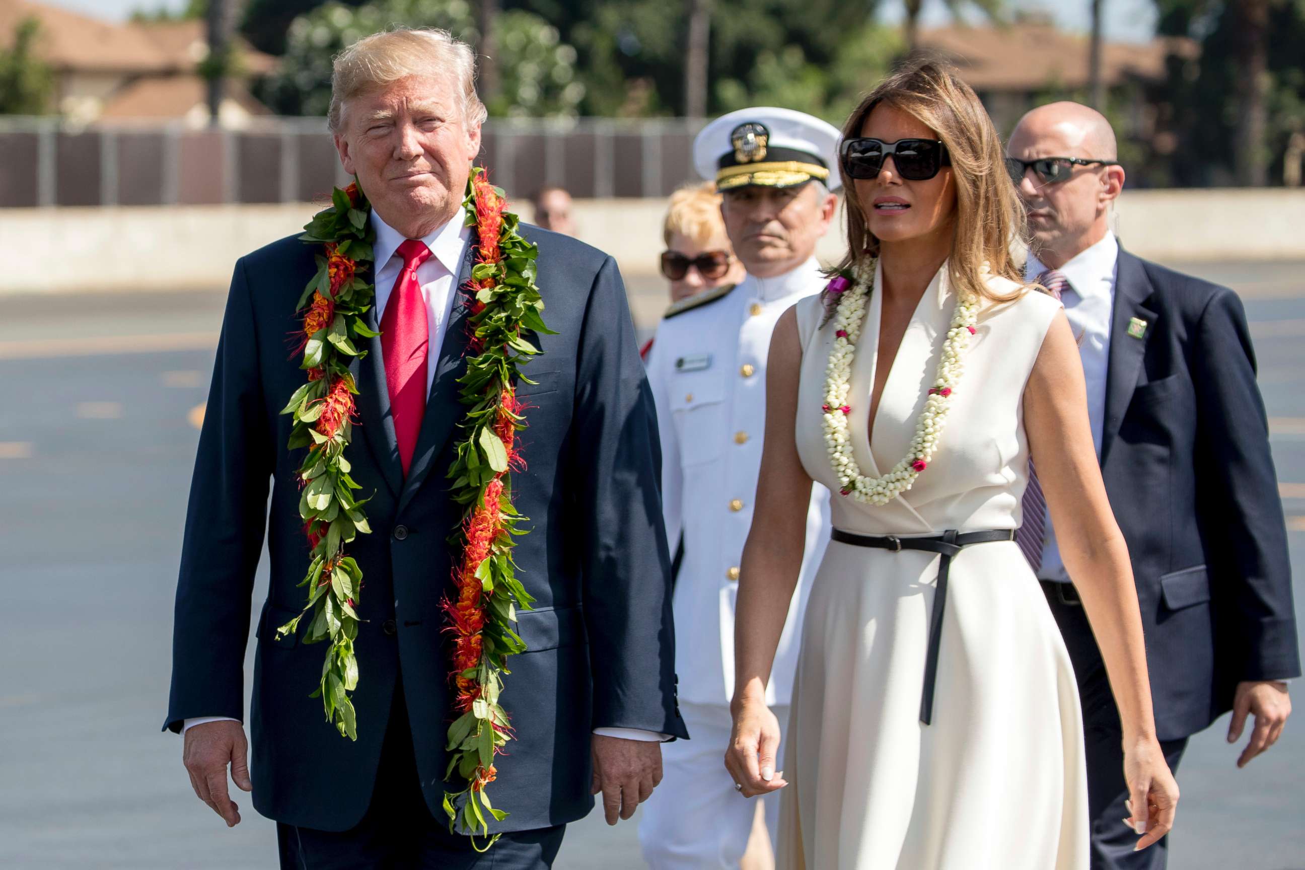 PHOTO: President Donald Trump and first lady Melania Trump wear leis as they arrive at Joint Base Pearl Harbor Hickam, Hawaii, Nov. 3, 2017. 
