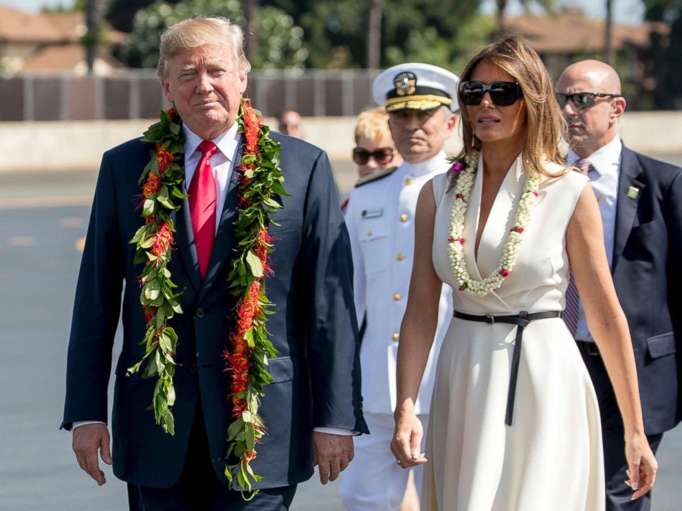 PHOTO: President Donald Trump and first lady Melania Trump wear leis as they arrive at Joint Base Pearl Harbor Hickam, Hawaii, Nov. 3, 2017.